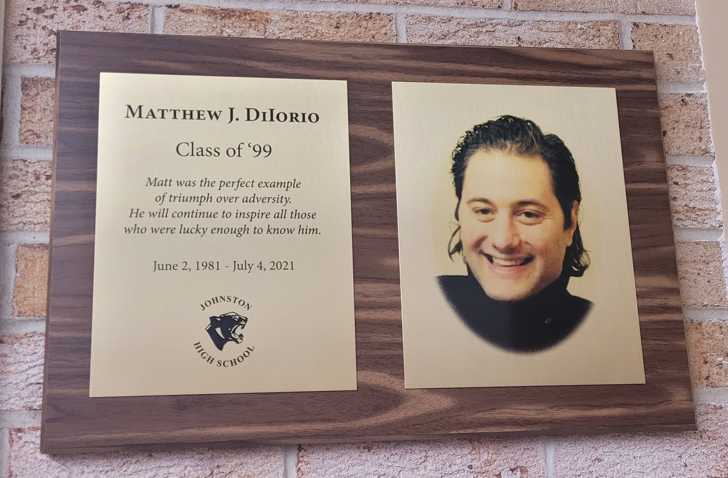 IN MEMORY: A plaque in memory of Matthew DiIorio now hangs behind the circulation desk in the Johnston High School library.